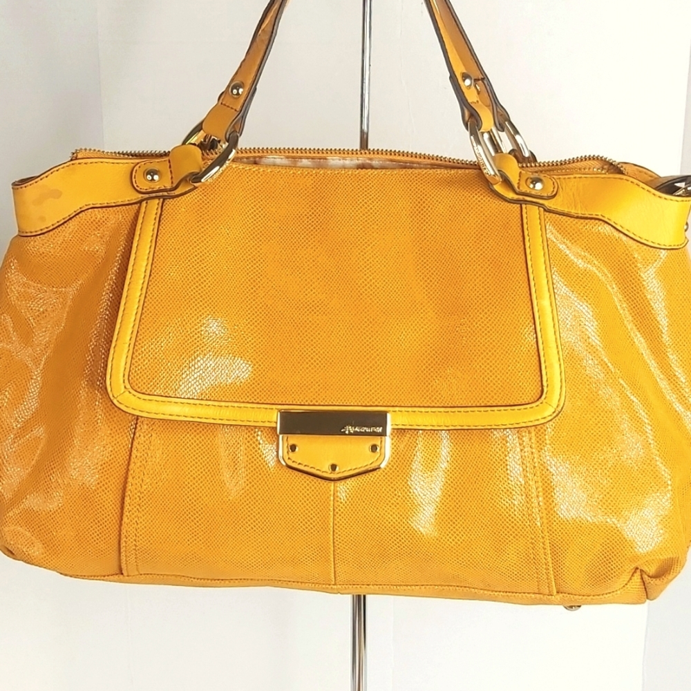 B. Makowsky animal print leather crossbody handbag.